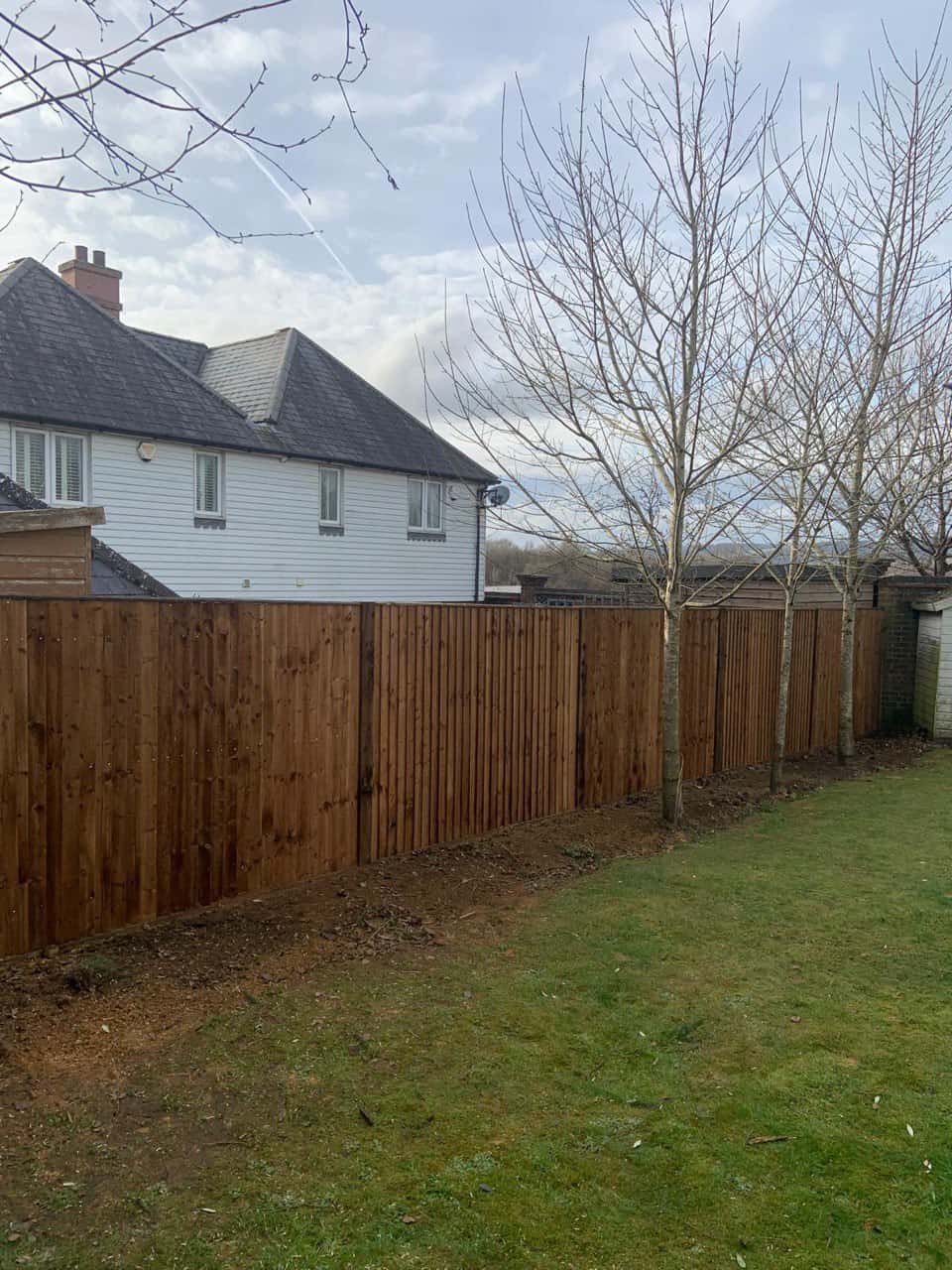 This is a photo of feather edge fencing installed in a residential properties garden by Fast Fix Fencing Wimblington