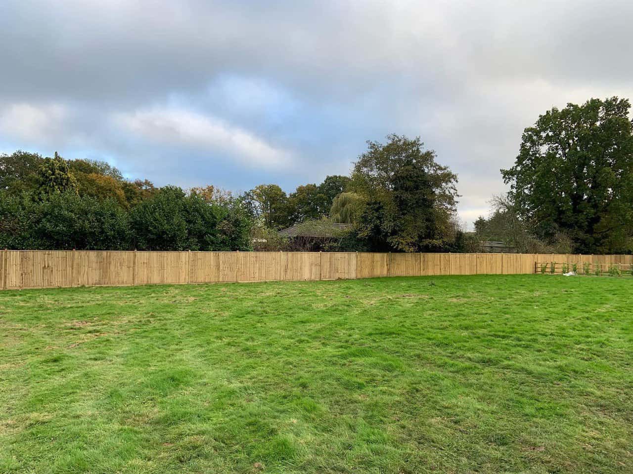 This is a photo of feather edge fencing installed around the edge of a field by Fast Fix Fencing Wimblington